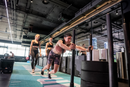 S&C V1 Woman pushing a gym sled